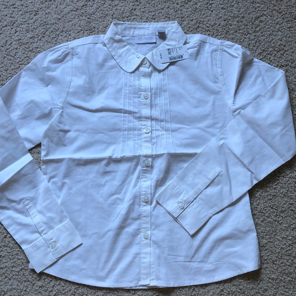Place white long sleeve blouse